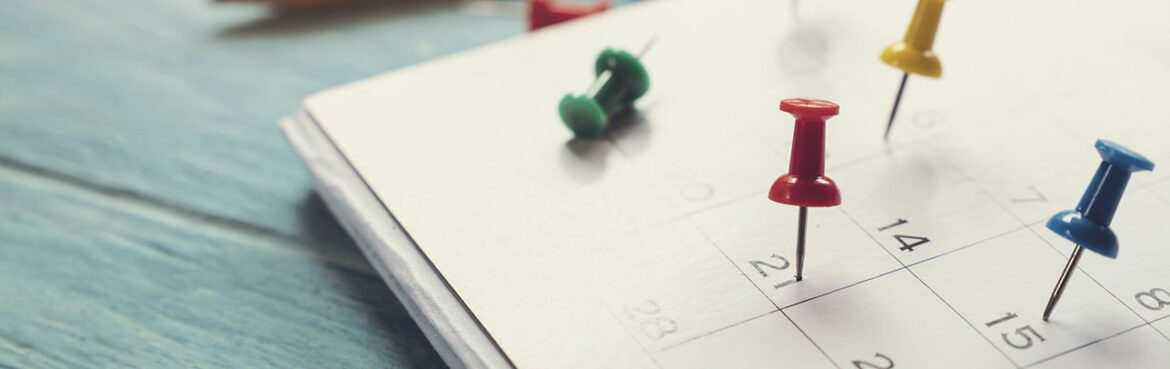 close up of calendar on the table, planning for business meeting or travel planning concept